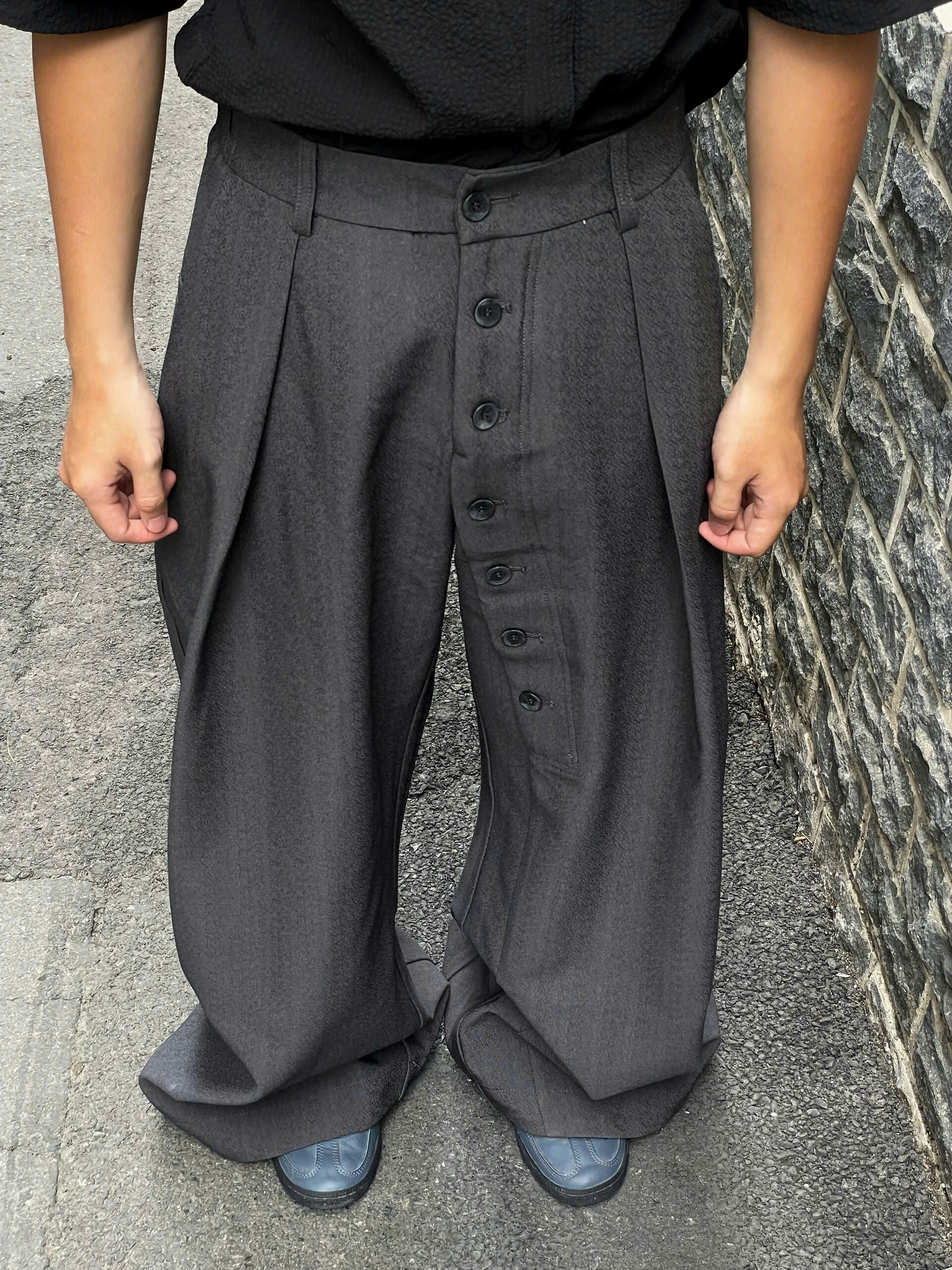 Loose Fit Pleated Buttoned Pants The Futurist Studio