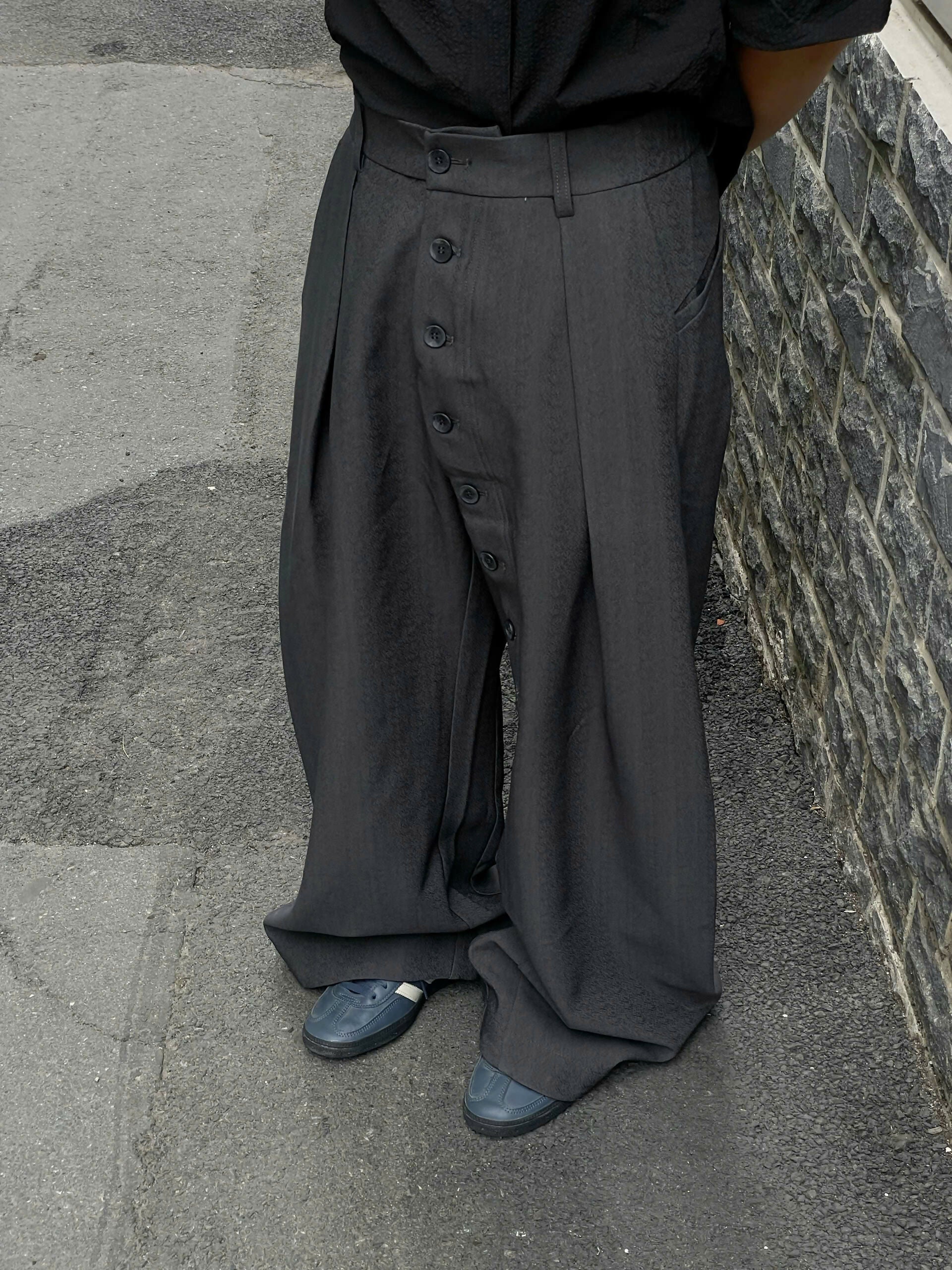Loose Fit Pleated Buttoned Pants The Futurist Studio